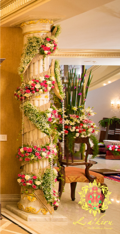 Photo of Floral arrangement aruond pillar