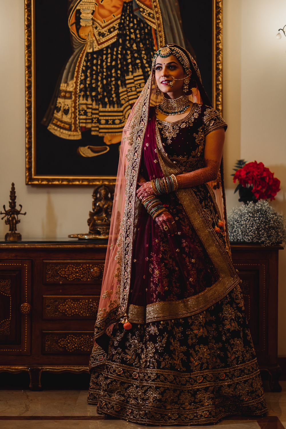 Photo of A bride in maroon lehenga with double dupatta