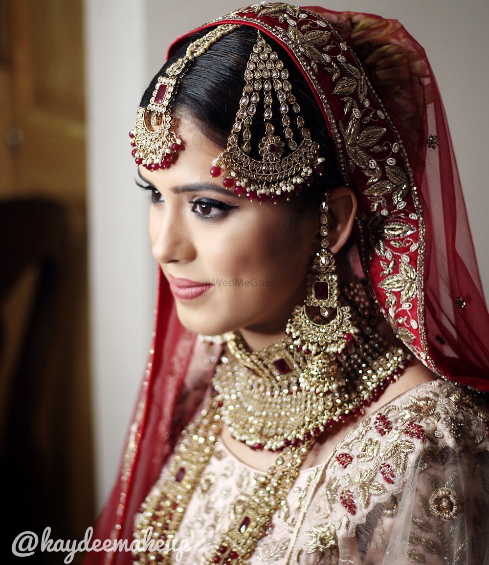 Photo of Bridal jewellery with red beads and jhoomer