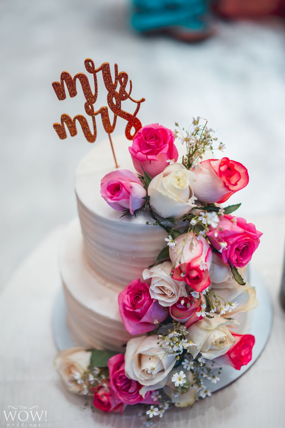 Photo of Floral wedding cake with mr and mrs cake topper