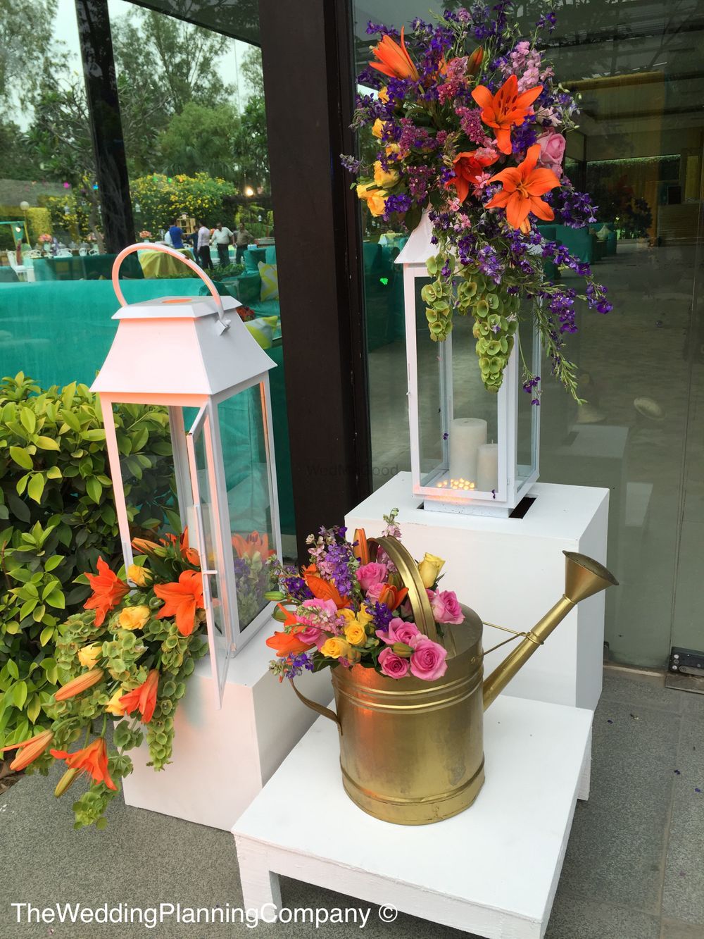 Photo of Gold Sprinklers and Lanterns with Floral Decor
