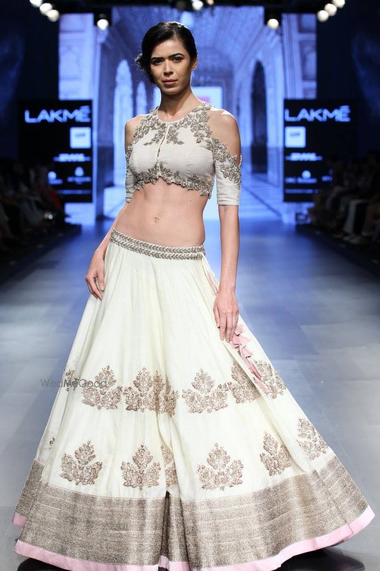 Photo of white and gold lehenga