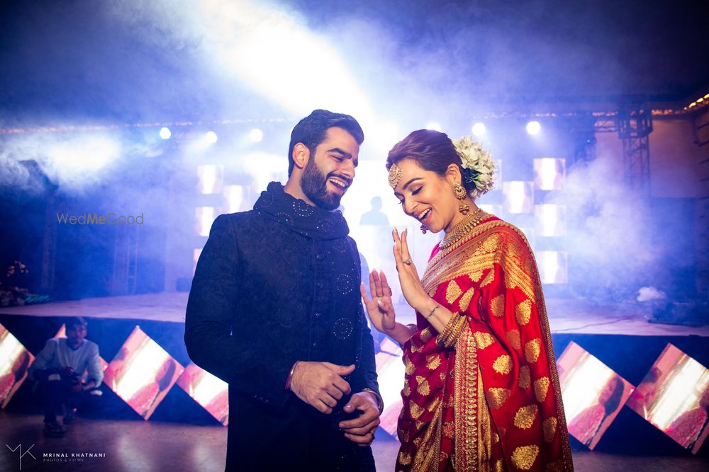 Photo of A happy couple caught in a candid moment on their reception.