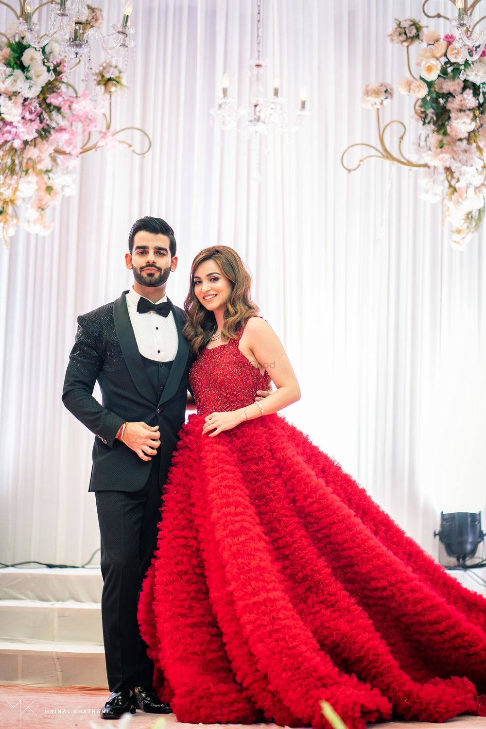 Photo of Feather floor length red gown for reception