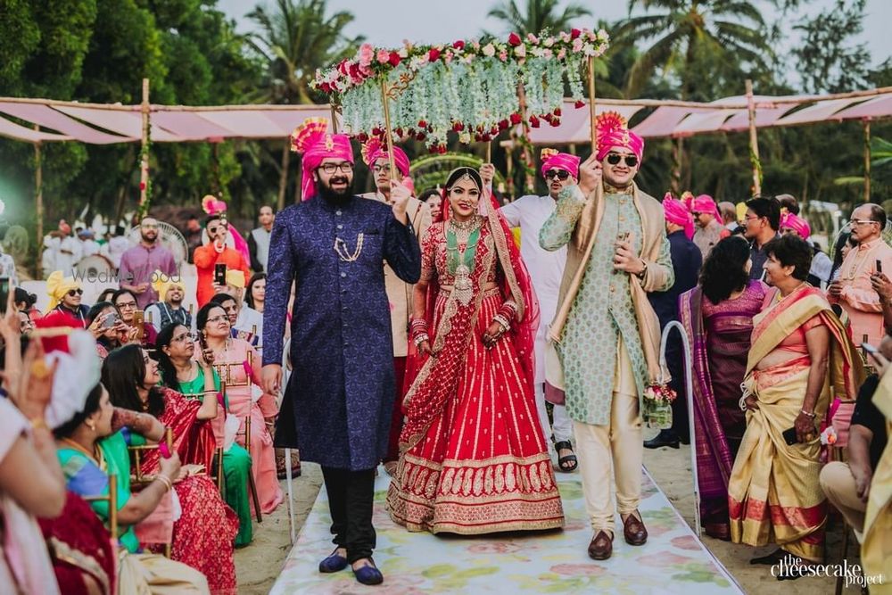 Photo of A bride entering her wedding under phoolon ki chadar.