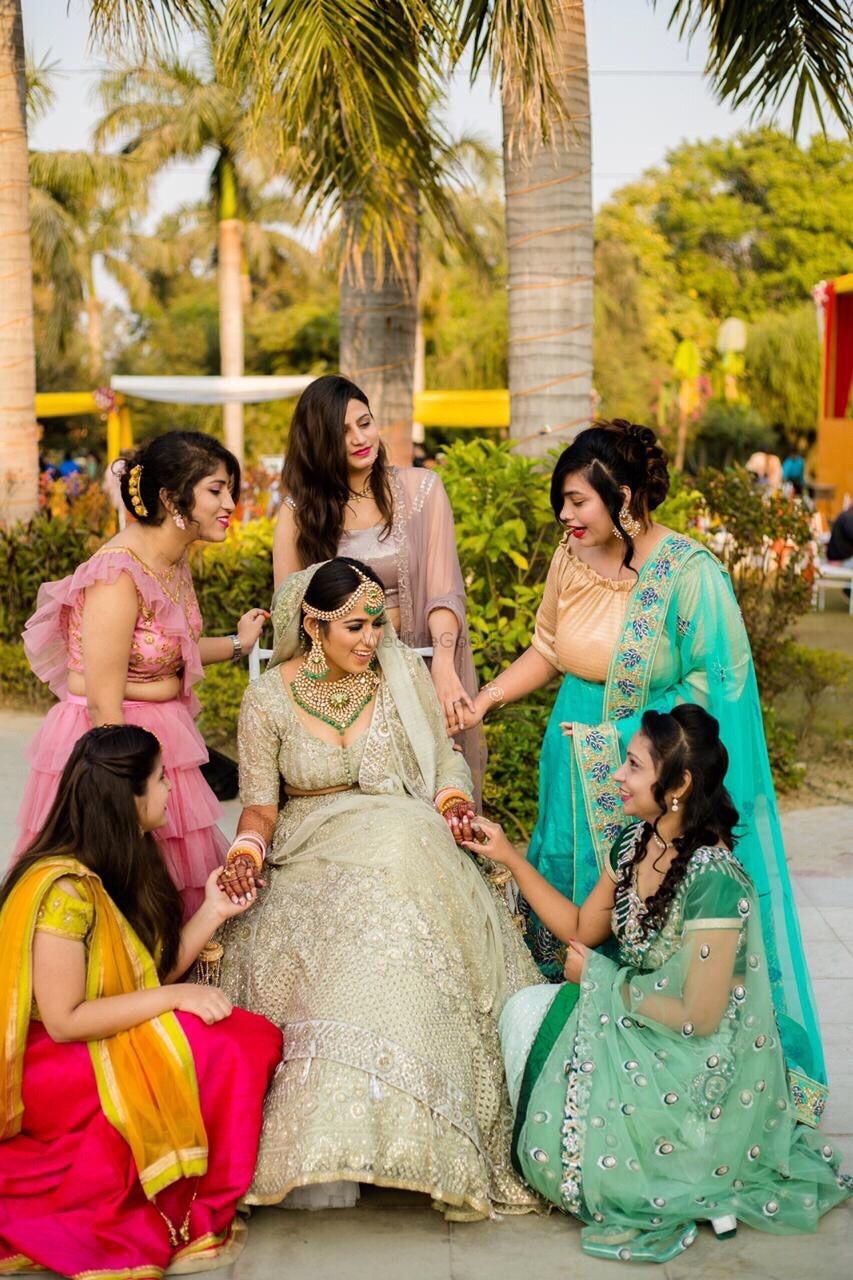 Photo of Brides with sisters around her for day wedding