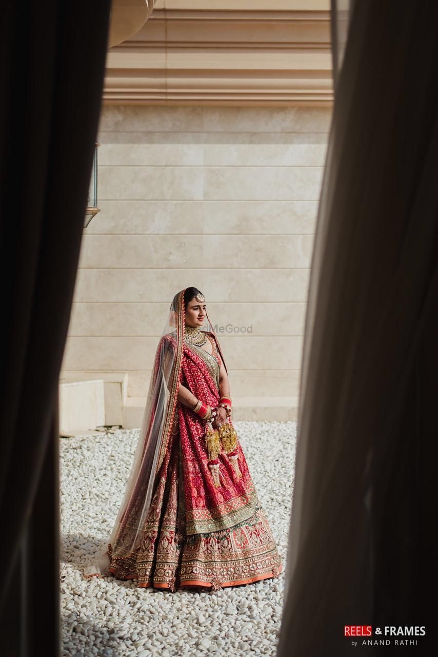 Photo of red and gold bridal lehenga with lots of embroidery