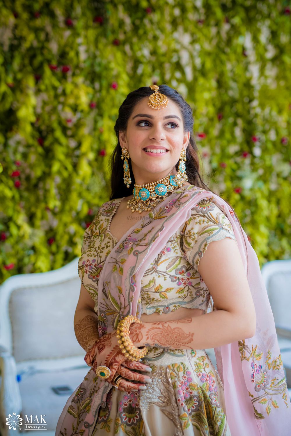 Photo of Mehendi bridal look with bright blue enamel jewellery