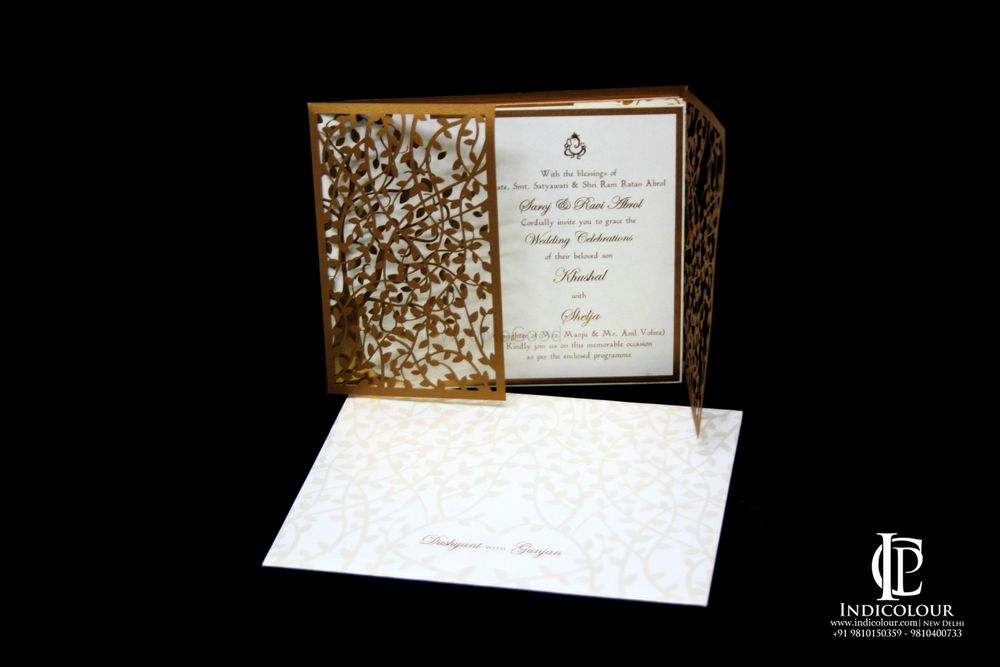 Photo of Gold and White Laser Cut Wedding Card