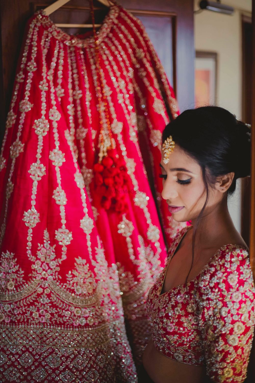 Photo of Bride with lehenga shot on hanger