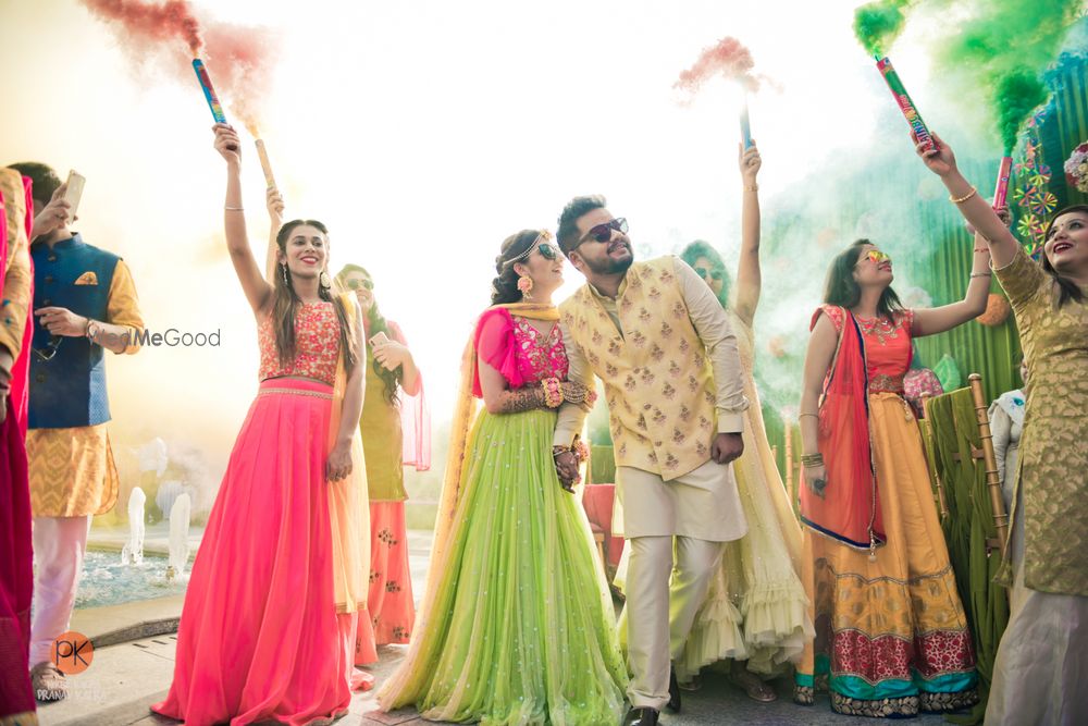 Photo of Couple entry on mehendi with smoke sticks