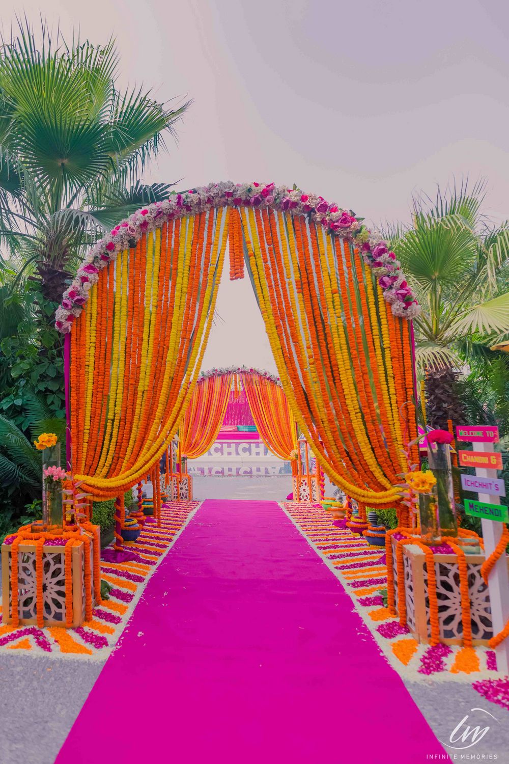 Photo of Mehendi entrance decor with floral archway