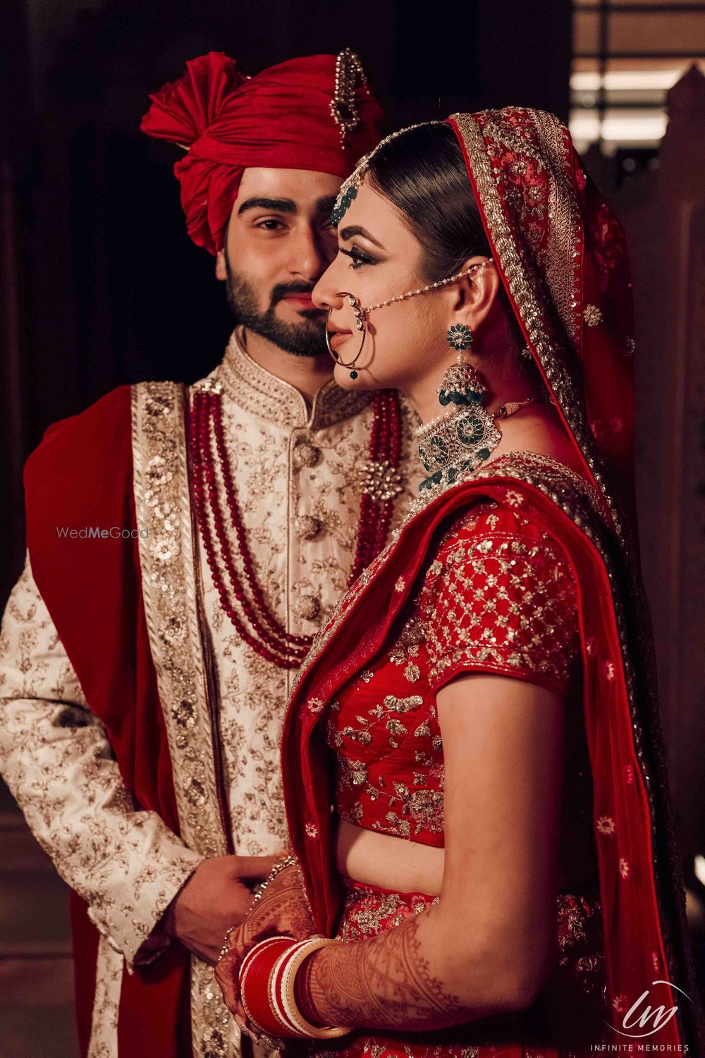 Photo of Matching bride and groom posing for modern portrait
