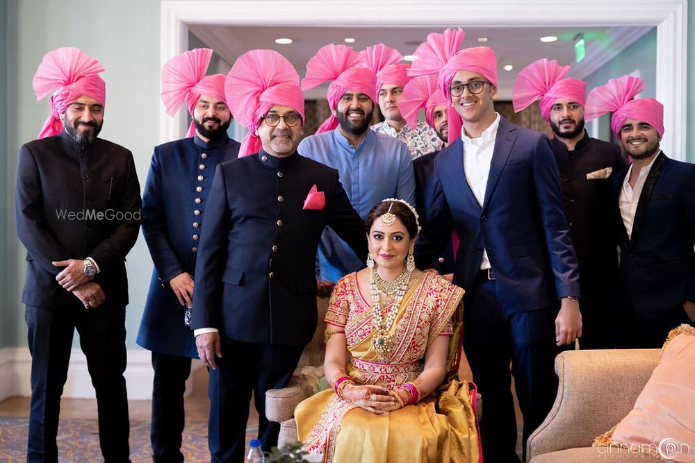 Photo of Bride with bridesmen and father wearing matching safas