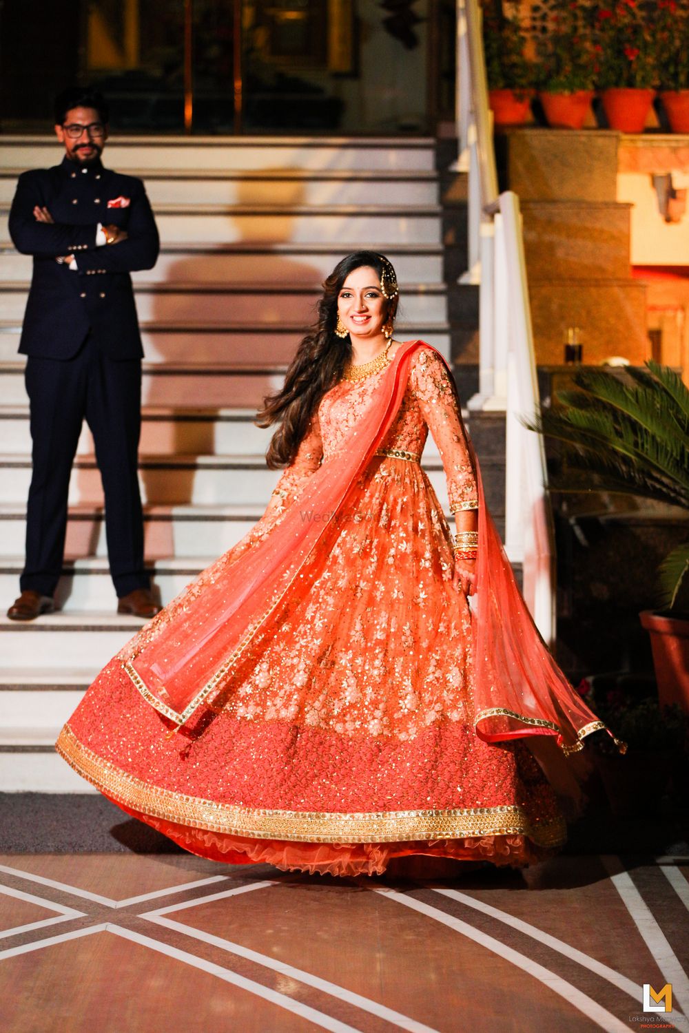 Photo of Twirling Bride in Orange Anarkali