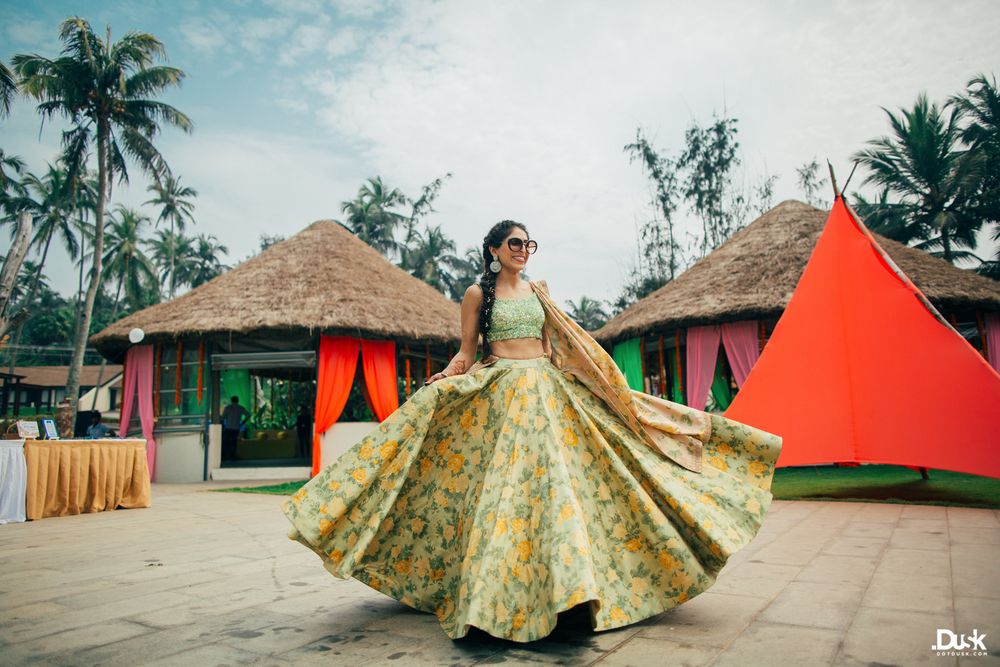 Photo of Twirling bride to be in floral lehenga on mehendi day
