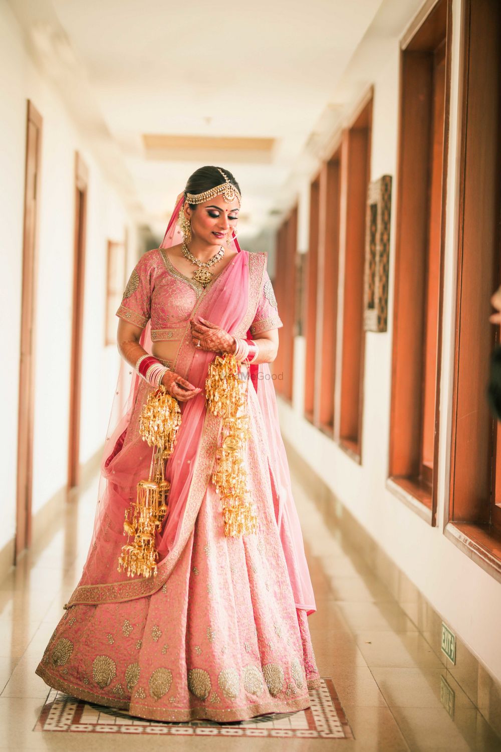 Photo of A stunning bride in her beautiful pink lehenga.