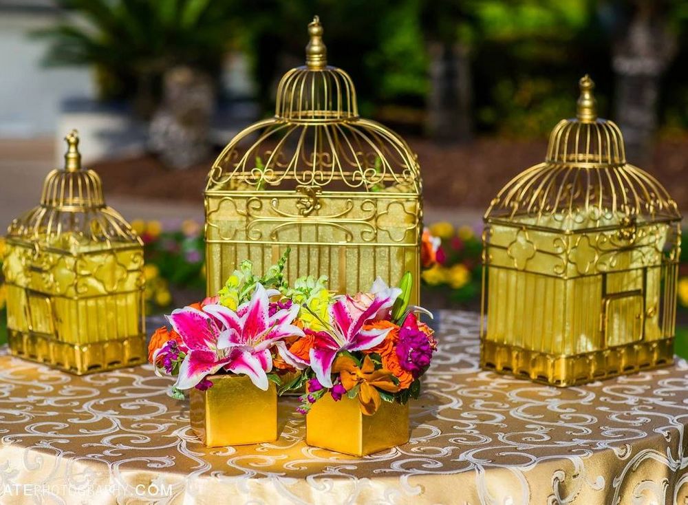 Photo of gold birdcages