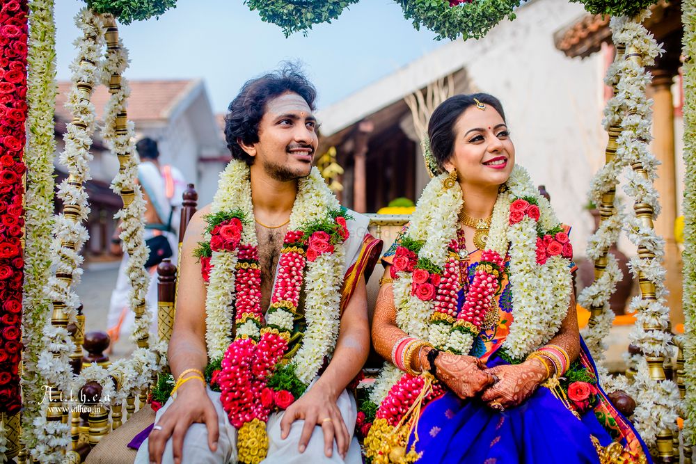 Photo of A south Indian couple with brightly colored outfits