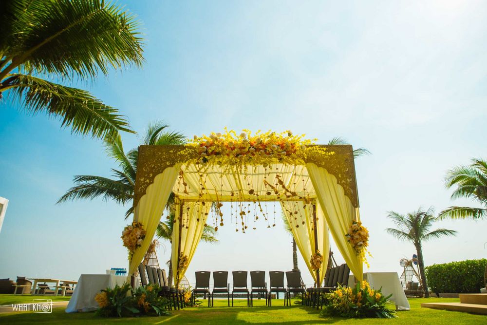 Photo of Daytime mandap in yellow colour with drapes