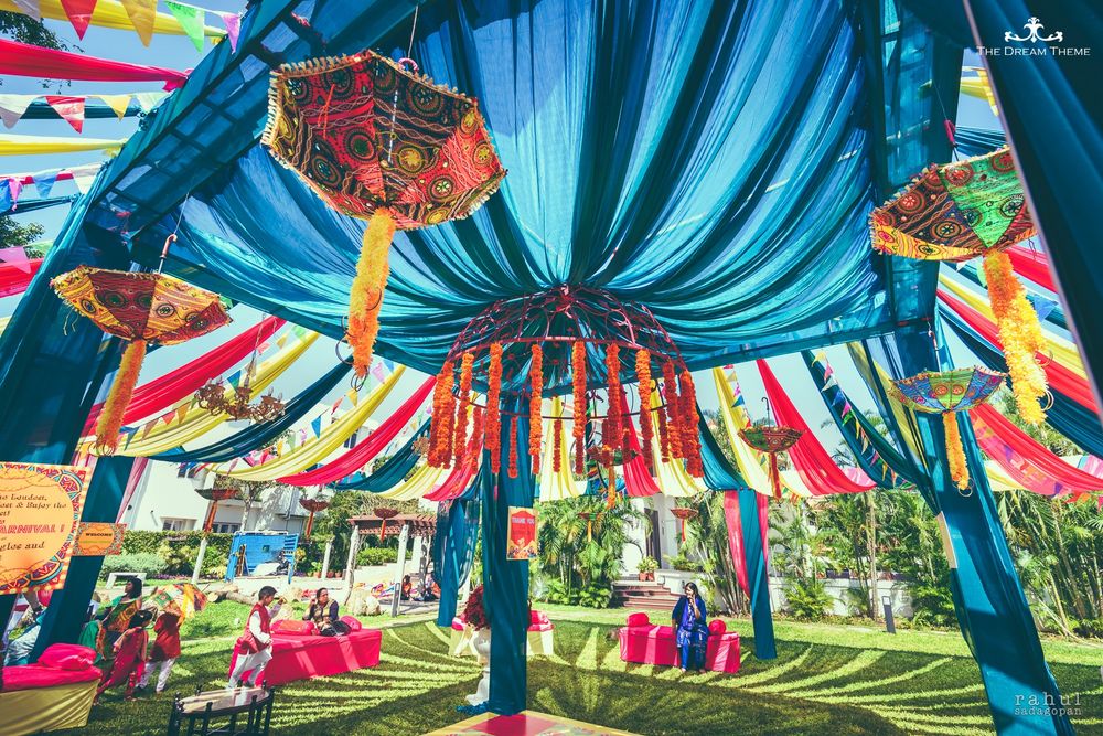 Photo of Mehendi decor idea with blue theme and hanging umbrellas