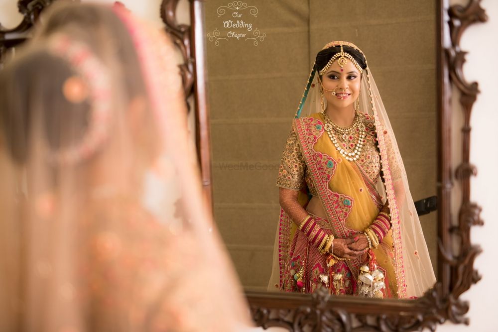 Photo of Bride Looking Through The Mirror