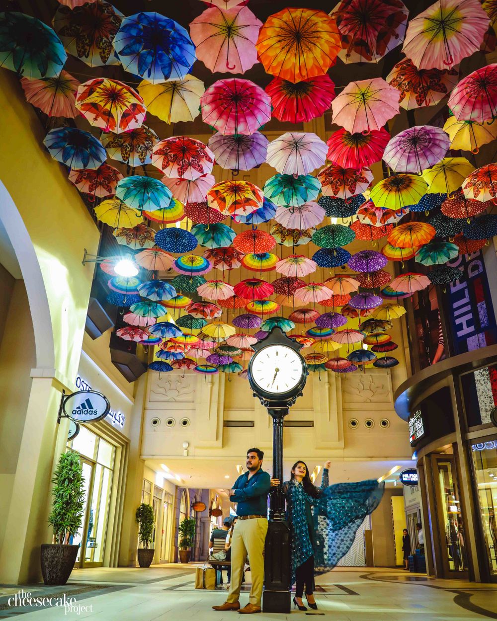 Photo of Pre wedding shot with umbrellas in ceiling