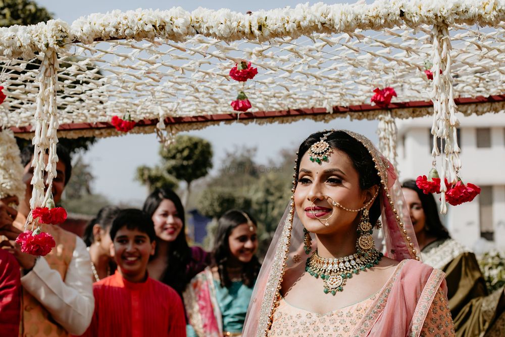 Photo of Bride entering under phoolon ka chadar