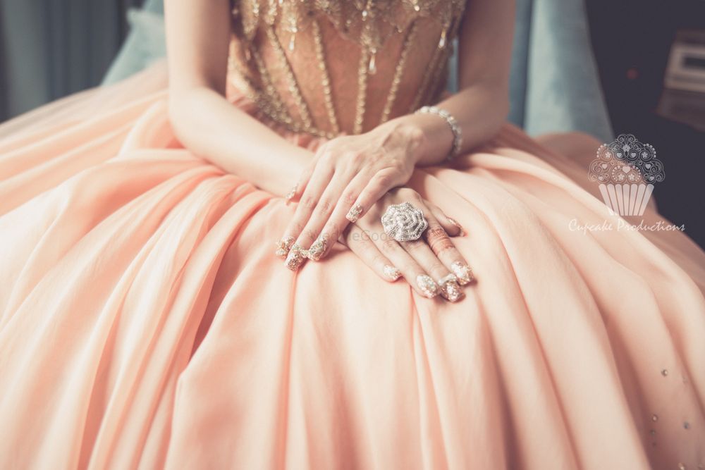 Photo of Silver cocktail ring worn by bride