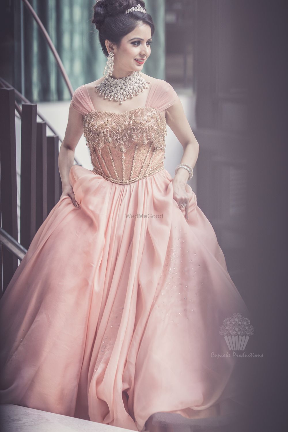 Photo of Peach gown worn by bride by Shantanu & nikhil
