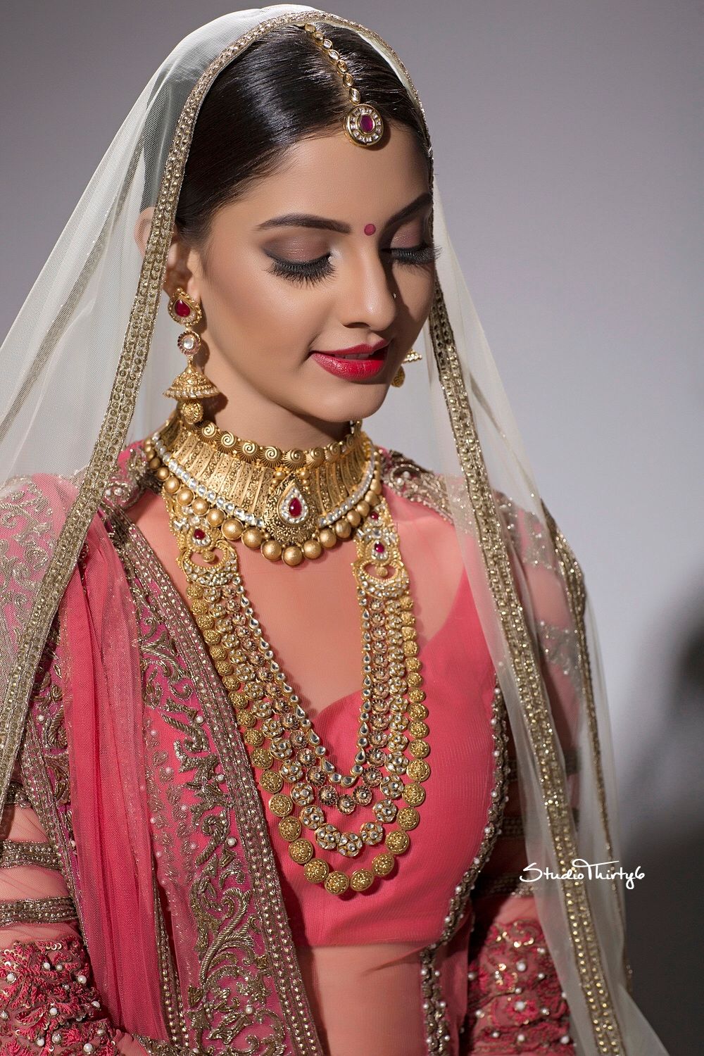 Photo of Simple bridal look with matte brown eyes and red lips