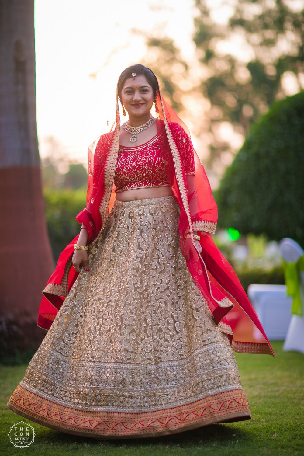 Photo of Red and Gold Twirling Bridal Lehenga