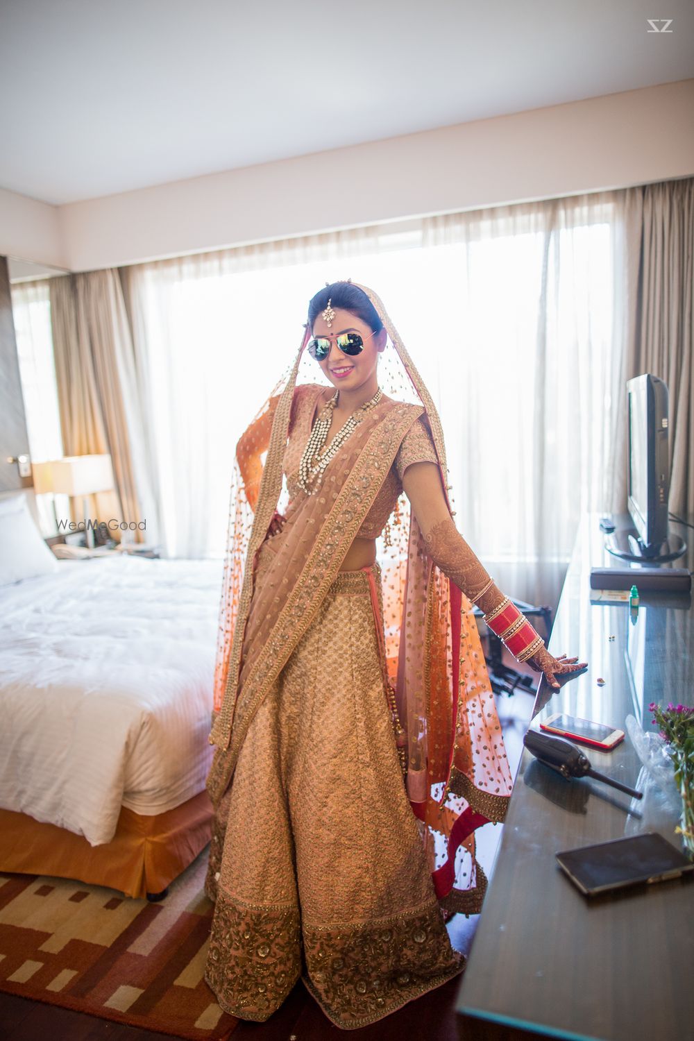 Photo of Peach and gold bridal lehenga