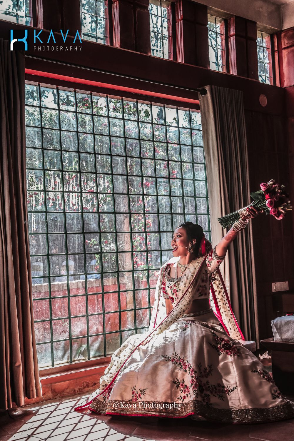 Photo of Happy bride shot holding a bouquet