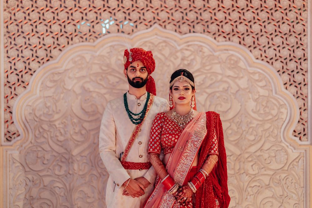 Photo of An adorable couple on their wedding in stunning outfits.