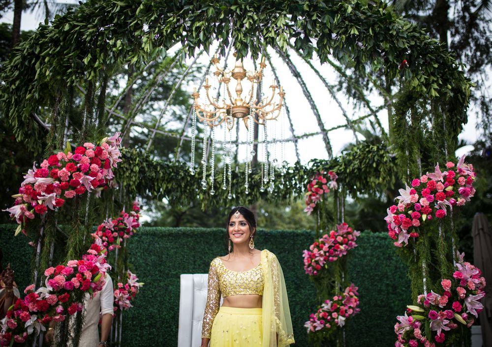 Photo of A to-be-married girl poses in a yellow lehenga for her mehendi