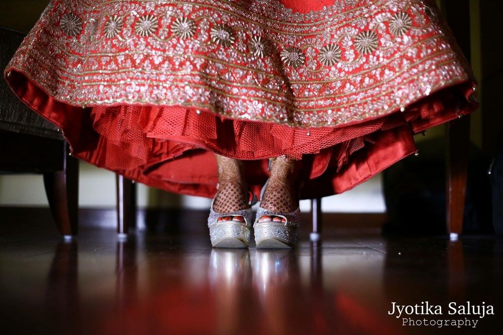 Photo of Silver Bridal Shoes and Red Lehenga Border