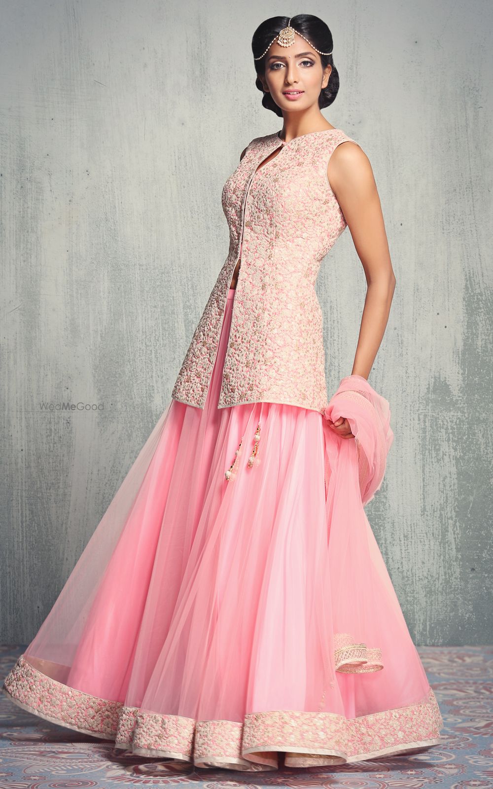 Photo of Pastel Pink Short Kurta with Net Lehenga