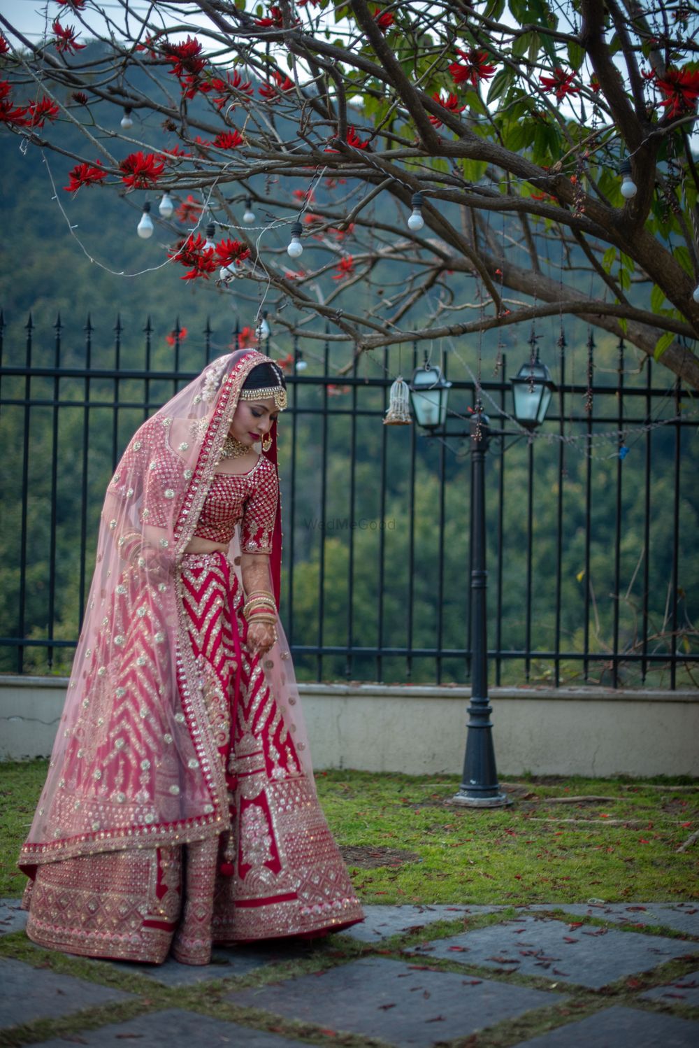 Photo of Bride in red and white lehenga with single dupatta drape