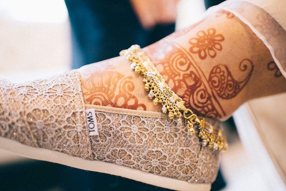 Photo of unique flat bridal shoes and pajeb
