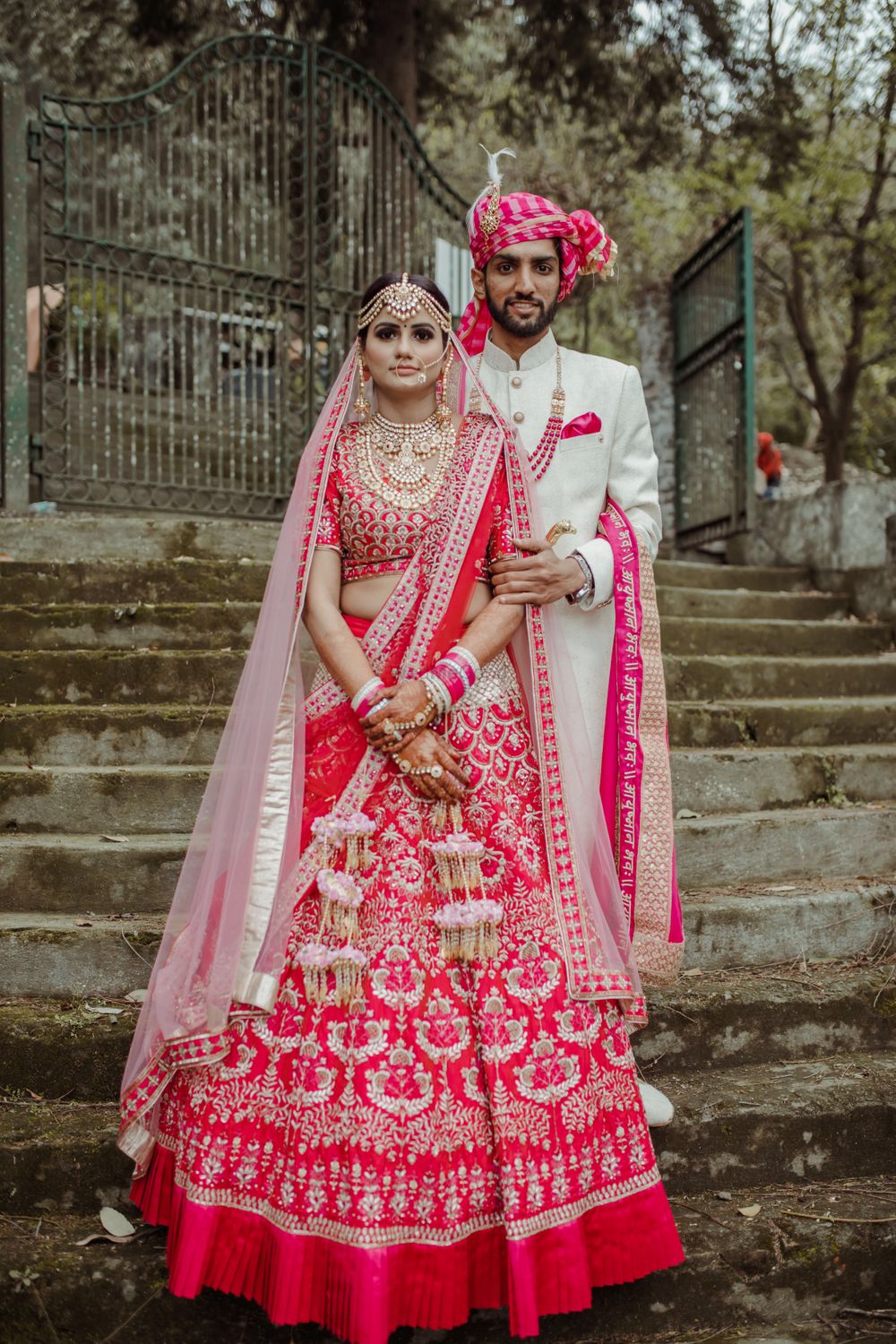 Photo of A beautiful couple portrait in color-coordinated outfits on their wedding.