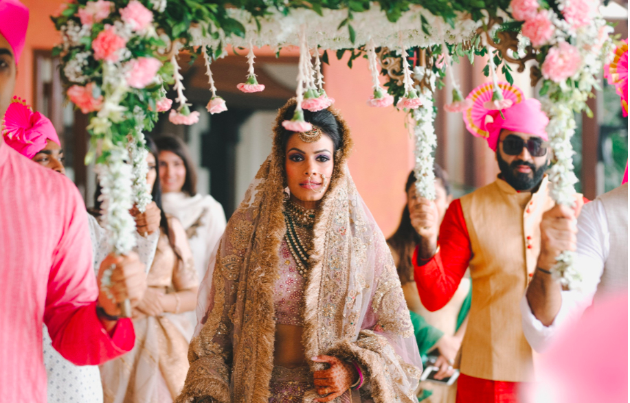Photo of Bridal entry wearing a unique traditional dupatta
