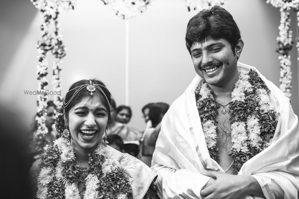 Photo of A happy and a bright couple monochrome shot on their wedding.