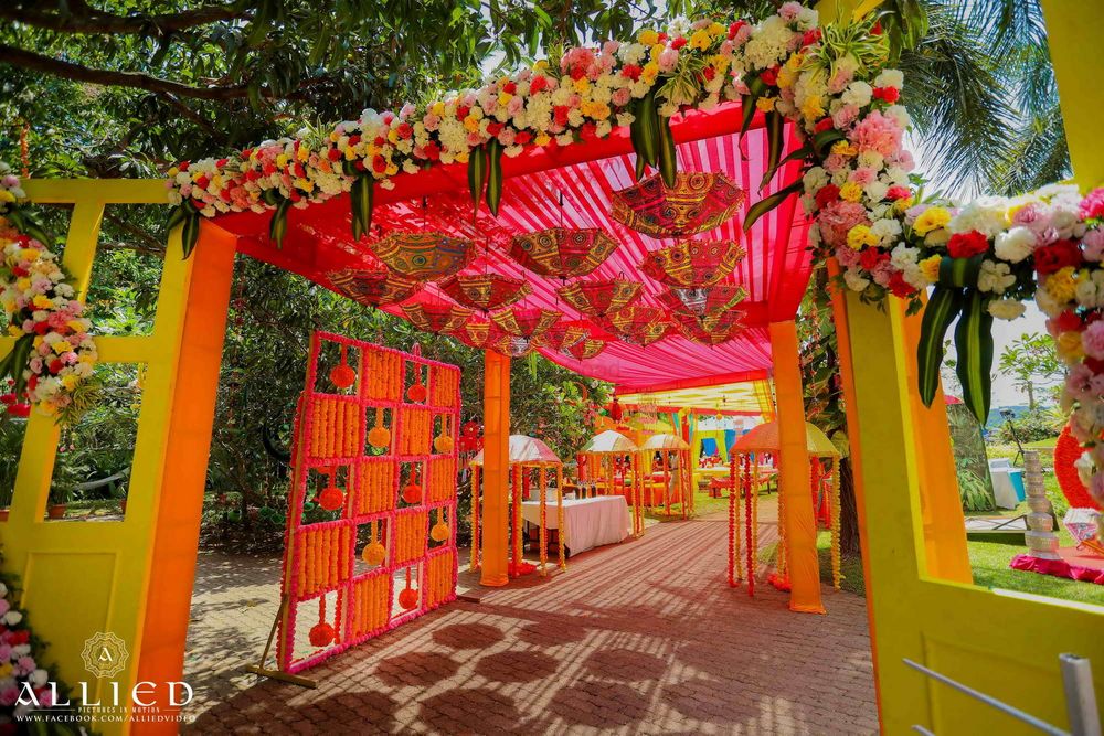 Photo of Mehendi entrance decor with hanging parasols