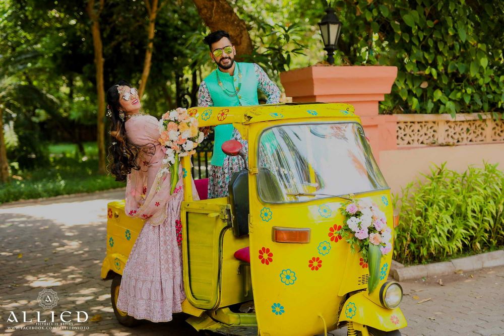 Photo of Bride and groom entry in decked up auto