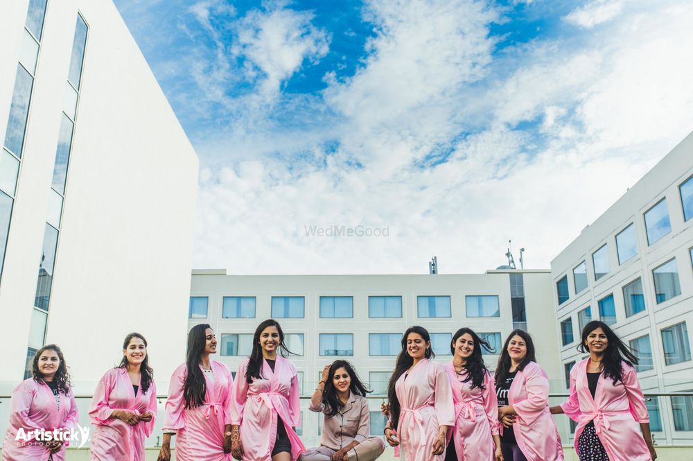 Photo of Bride with her bridesmaids all in robes