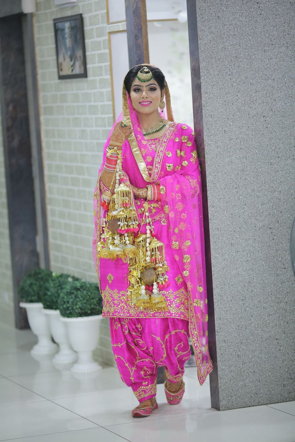 Photo of Fuchsia Pink Sikh Bride with Kaleere