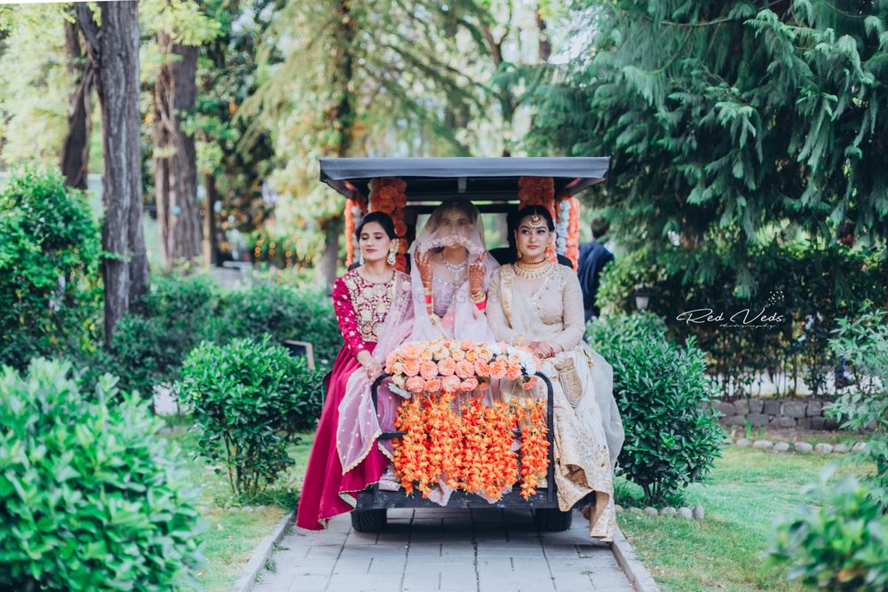 Photo of Bride making her entrance on ATV with bridesmaids