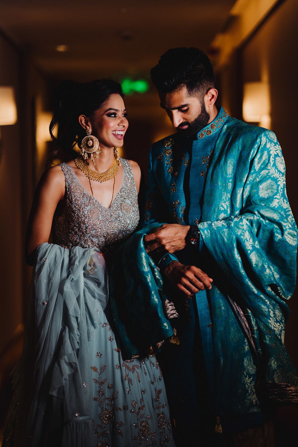 Photo of Matching bride and groom with him wearing benarasi dupatta