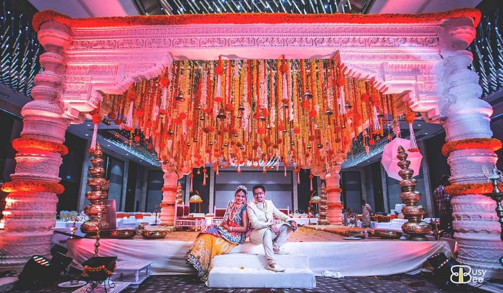 Photo of White Wedding Mandap with Genda Phool Decor